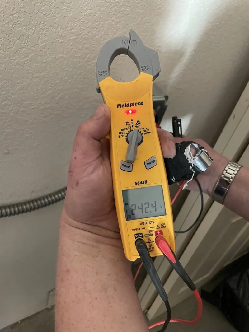 Voltage testing with clamp meter during Outlet Installation in Blue Island
